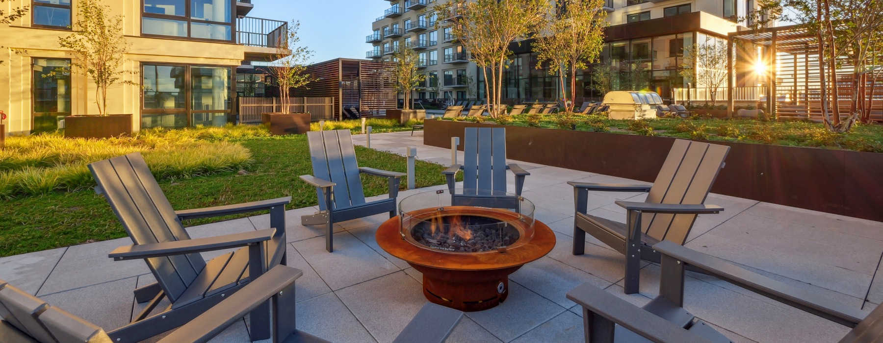 Outdoor courtyard with fire pit and bbqs