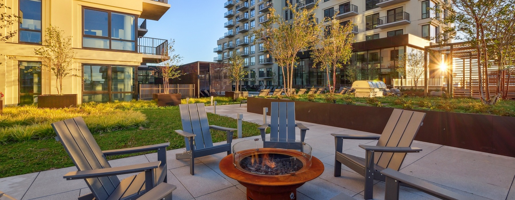 Outdoor courtyard with fire pit and bbqs