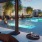 People relaxing at resort-style pool and hot tub at 18 Dock luxury rentals in Stamford, CT.