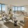 Large living and dining room with large windows and outdoor terrace at 18 Dock apartments Stamford.