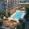 Amenity terrace with swimming pool in a courtyard at 18 Dock apartments, Stamford.