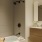 Spa-like bathroom with tub and custom vanity at 18 Dock apartments in Stamford CT.