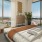 Bedroom with huge windows and city view at 18 Dock luxury apartments in Stamford, CT.